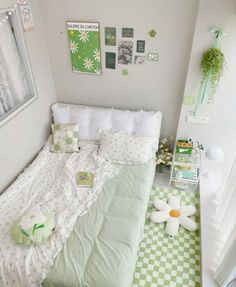 a small bedroom with green and white checkered flooring