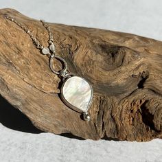 "an iridescent petal shaped mother of pearl  set with a single sterling pebble... from a petite ball chain accented with little moonstones  and a second silver petal... 17\" with a 2\" extension" Boho Mother, Mother Of Pearl Necklace, Pearl Set, Necklace Boho, Turquoise Earrings, Moon Stone, Ball Chain, Boho Necklace, Pearl Pendant