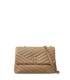 Directly from Tory Burch - The Kira Convertible Shoulder Bag is made of soft chevron-quilted leather with beveled Double T hardware. An adjustable chain strap adapts in the moment - doubled over the shoulder, or long and crossbody. Tory Burch Official Site. Quilted Crossbody Bag For Work, Kira Chevron Convertible Shoulder Bag, Tory Burch Kira Chevron, Kira Chevron, Tory Burch Kira, Womens Designer Handbags, Designer Shoulder Bags, Quilted Leather, Chain Strap