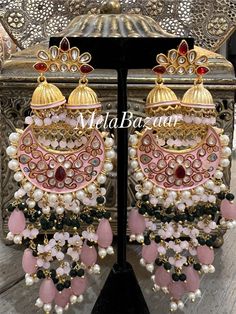 Handmade earrings from Jaipur, crafted with perfection! Meenakari work with Kundan inspired stones and pearls. Perfect statement earrings! Length: 12.5 cms Traditional Multicolor Pearl Drop Earrings, Traditional Festive Beaded Earrings With Pearl Drop, Traditional Festive Beaded Pearl Drop Earrings, Traditional Pink Beaded Earrings For Party, Pink Traditional Beaded Earrings For Party, Festive Pink Pearl Drop Earrings, Festive Pink Bridal Earrings With Pearl Drop, Handmade Chandbali Chandelier Earrings, Elegant Beaded Drop Earrings