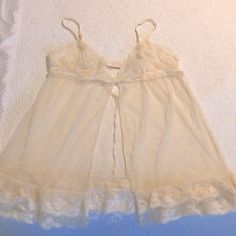 Brand New Never Used. Vintage And Classic Elegant Style Colors And Cut. Like A Like Cream Color Maybe Considered Off White/Beige. Beautiful And Stunning. Adjustable Straps And Closure In Back Fitted Sheer Sleepwear For Loungewear, Lace Chemise In Coquette Style For Loungewear, Sheer Lace Chemise For Sleep, Victoria's Secret Sheer Tops For Loungewear, Delicate Lace Coquette Sleepwear For Loungewear, Coquette Delicate Lace Sleepwear For Loungewear, Fitted Sheer Victoria's Secret Sleepwear, Sheer Lace Sleepwear, Sheer Lace Sleepwear For Bedtime