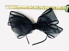 Black bow Fascinator - Bow Wedding Headpiece -chiffon and satin bow- Kentucky derby- Big bow Headband Hi, This triple bow headband has a handmade 4 inch chiffon with black satin edge. 10 inches long. It's sprayed with stiffener to hold its shape. Colors: Black Navy It's all placed on a 1/8 inch covered headband. This covered headband fits any head size and very comfortable. Plus no headaches! Pick a headband that matches Your hair color so it blends in. Light weight! For all ages...5 to 85 I am Black Bow Tie For Summer Party, Summer Bow Headband, Summer Decorative Bow Headband, Black Summer Party Bow Tie, Spring Party Hair Accessories With Decorative Bow, Adjustable Satin Bow For Evening, Spring Satin Bow Headband, Summer Satin Bow Headband, Black Ribbon Bow For Evening