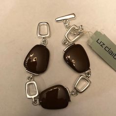 Liz Claiborne Silver Bracelet With Brown Stones. Brand New. Trendy Brown Metal Bracelets, Elegant Brown Bracelet With Lobster Clasp, Brown Metal Bracelet For Formal Occasions, Formal Brown Metal Bracelet, Trendy Brown Rectangular Bracelet, Modern Brown Metal Bracelets, Modern Brown Metal Bracelet, Liz Claiborne, Womens Jewelry Bracelets