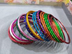 Welcome to our shop We bring to you very ethnic products from core of India almost every thing is handmade or custom made Set of 22 Bangles in multiple colors Size 2.4 We will be happy to serve you Handmade Pink Bracelets For Festive Occasions, Handmade Pink Bracelets For Festive Season, Handmade Pink Festive Bracelets, Traditional Adjustable Multicolor Bangle, Multicolor Bangle Bracelets For Festive Occasions, Festive Multicolor Bangle Bracelets, Handmade Multicolor Bracelets For Festive Occasions, Bohemian Multicolor Bangle For Gift, Multicolor Festive Bracelet For Festivals