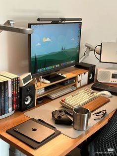 a computer desk with a monitor, keyboard and mouse