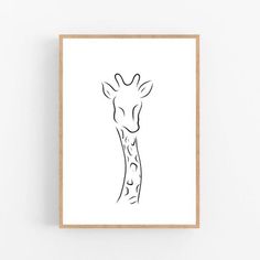 a black and white drawing of a giraffe's head on a wall