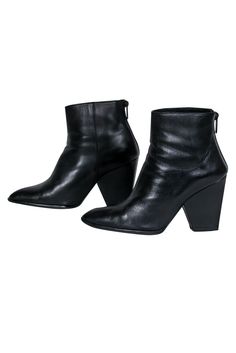 Go fierce this fall with these luxe booties from Stuart Weitzman! The classic ankle boot is upgraded with buttery soft leather and a dramatic chunky heel. Perfect for a night out during those crisp months. Style with distressed jeans and a faux fur jacket for a sleek and sultry look you can rock to the club and beyond! Size 7.5 Leather upper Back zipper closure Ankle high shaft Pointed toe Chunky heel Leather sole and footbed w/ light wear Original dustbag included Shaft 3" Heel 3.75" Winter Chelsea Boots With Stacked Heel, Fall Moto Boots With Stacked Block Heel, Fall Ankle-high Boots With Reinforced Heel, Fall Ankle Moto Boots With Reinforced Heel, Fall Ankle Platform Boots With Stacked Heel, Ankle-high Boots With Reinforced Heel For Fall, Chic Platform Boots With Leather Sole For Fall, Classic Fall Boots With Block Heel, Classic Block Heel Boots For Fall