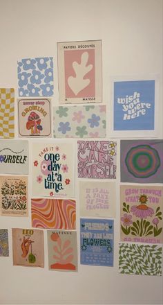 a wall that has many different types of cards on it, including one with flowers and the other with words