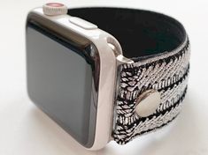 an apple watch band with black and white designs