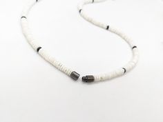 Hawaiian fish hook, carved black bone necklace: Pick your length necklace. You can almost hear the sandy beaches calling with this white shell necklace. Strong yet earthy creation by JT Maui features white shell, black bone in approximately 6mm width . A beachy combination that's so comfortable you'll wear it everyday. QUALITY MADE: Durable and rugged, yet comfortable. Hand beaded on a multi-strand stainless steel beading wire  CLASP: Secure screw in barrel clasp closure included. ultra comforta Maui Style, White Shell Necklace, Hawaiian Fish, Wire Clasp, Fish Hook Necklace, Hook Necklace, Surfer Style, Bone Necklace, Puka Shell