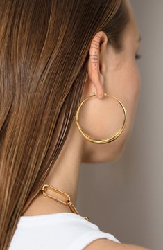 Crafted of recycled sterling silver and plated in 18-karat gold, these oversized hoops feature an organic sculptural design for a modern look. Style Name:Monica Vinader Deia Hoop Earrings. Style Number: 6203971. Available in stores. Contemporary Everyday Gold Jewelry, Modern Gold Hoop Earrings In Sterling Silver, Everyday Luxury Chic Hoop Jewelry, Chic Everyday Luxury Hoop Jewelry, Modern Gold Plated Polished Hoop Earrings, Modern Gold Plated Hoop Earrings With Polished Finish, Modern Small Hoop Gold Plated Jewelry, Contemporary Metal Hoop Earrings, Modern Recycled Gold Jewelry For Everyday Luxury