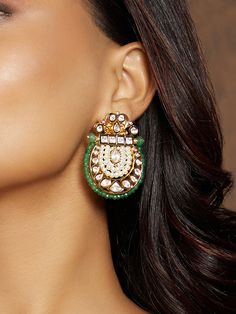 This designer earring is a crafted masterpiece, featuring multi-shaped polkis adorned with strings of classic pearls and a border of green cut agate beads. Ideal for festive occasions, weddings, and parties, it adds a touch of elegance to both Indian and fusion attire. Every piece is handcrafted with real semi-precious stones, ensuring a regal look and feel that complements your unique style Finish: 22KT Gold Plating Material: Brass, Hydro Polkis, Beads, Freshwater Pearls Color: Gold, Green, Whi Pearl Fusion, Hand Jewelry Rings, Chain Braid, Hand Jewelry, Anklet Jewelry, Pearl Color, Charm Gift, Agate Beads, Designer Earrings