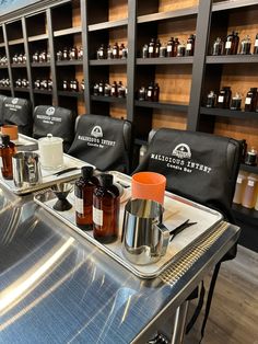 the inside of a barbershop with many bottles of hair products