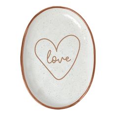 a white plate with a heart and the word love written on it's side