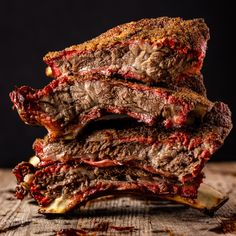 beef back ribs stacked on top of each other with the words smoked beef back ribs