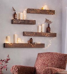 three wooden shelves with candles on them