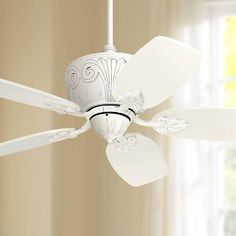 a white ceiling fan in a living room