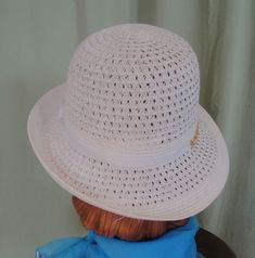 "This is a lovely vintage hat, that dates from the 90's. Label reads, \" San Diego Hat Co\". Made of polyester & paper straw. Tagged a size Women's O/S. It is an ivory mesh fedora with a white grosgrain ribbon hatband with chain accent. Brim can be worn up or down. Measures 22.5\" around the inside. The hat is in good, vintage condition. Shows no damage or wear. Chic!" Vintage White Fedora Hat, Vintage White Panama Fedora Hat, Vintage White Sun Hat For Vacation, Vintage White Bucket Hat For Summer, Vintage White Panama Hat With Curved Brim, White Vintage Boater Hat With Short Brim, Vintage White Sun Hat With Short Brim, Vintage White Hat Band For Summer, Vintage White Hat Bands For Summer