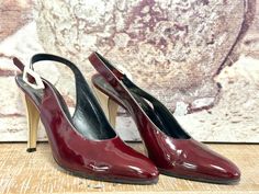 80s YSL VTG Yves Saint Laurent YSL Paris Patent Leather Pumps Italy 8M Dark Red with contrasting creamy white heels, leather soles- love the off-white buckle detail... and are in excellent vintage condition, no scuffs on the patent leather-The leather is supple and wearable. The only flaw is the light-colored heel is ever so slightly discolored. Length inside -10" Width -3" Heel - 4" Ysl Paris, Colorful Heels, White Heels, Patent Leather Pumps, Creamy White, Leather Pumps, Womens Heels, Women's Pumps, Dark Red