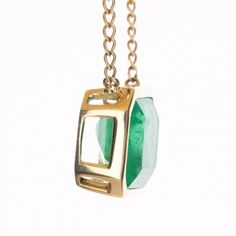 Take a glimpse of this stunning, emerald and diamond necklace. The featured stone is a large, Colombian emerald-emerald cut with 8.80-carats of pure beauty! The stone displays an enchanting medium-green color, with a minimal yellow hue. Bezel set, east to west, in 14K yellow gold. This pendant, is stationary with a diamond by the yard necklace, giving it so much more detail to this class solitaire. Green 14k Gold Jewelry With Single Cut Diamonds, Timeless Emerald Necklace Gift, Luxury 14k Gold Emerald Necklace For May Birthstone, Timeless Emerald Necklace With 17 Jewels For Gift, Formal Emerald Necklace With Single Cut Diamonds, Timeless Emerald Necklace As Gift, Luxury Gold Emerald Jewelry With Single Cut Diamonds, Green Diamond Cut Emerald Pendant Necklace, Gold Emerald Jewelry With Single Cut Diamonds