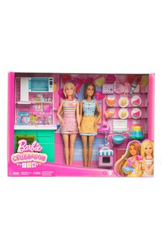 a barbie doll in a pink kitchen playset