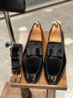 Elevate your formal attire with our Black Tuxedo Loafers. These meticulously handcrafted loafers boast a striking combination of premium black leather and luxurious velvet, making them the perfect finishing touch for any special occasion. The unique bow-tie detail adds a touch of personality and charm, ensuring you stand out with understated elegance. Premium Craftsmanship: Expertly handmade using 100% genuine leather and a luxurious velvet blend. Distinctive Design: The eye-catching bow-tie det Classic Brogue Loafers For Party, Classic Party Loafers With Brogue Detailing, Classic Wingtip Loafers For Party, Luxury Semi-formal Tassel Loafers, Black Luxury Wingtip Loafers, Formal Black Monk Strap Shoes With Brogue Detailing, Luxury Black Wingtip Loafers, Black Monk Strap Shoes With Brogue Detailing For Formal, Classic Leather Tassel Loafers For Party