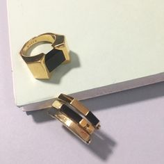 An architectural touch. The Big Block Ring features a prismatic stone held between white, gold, or rose plated sterling silver, while the Flip Ring with Stones brings together a multi-metal, multi-colored piece that is irresistible to wear---and play with all day. Classy statement or versatile elegance: you can't go wrong either way! Tap now to shop!  #Minimalistic #Simple #Chic #Elegant #Luxury #Modern #nyc #Fashion  #accessories #gold #rings #gemstone #gift #design #Classy #Trendy #Jewelry Flip Ring, Rings Gemstone, Accessories Gold, Gift Design, Simple Chic, Black Agate, Nyc Fashion, Trendy Jewelry, Stone Rings