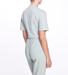 Super soft short sleeve athleisure top with front twist detail and relaxed cropped fit. Is suited for any type of activity. The Amelia tee is light, breathable, and flexible. The pale sage color also makes it perfect to be worn with the Remy sweatpants. Crystal Bra, Gown Skirt, Athleisure Tops, Sage Color, Cropped T Shirt, Soft Shorts, Marchesa, Skirt Length, Sage Green