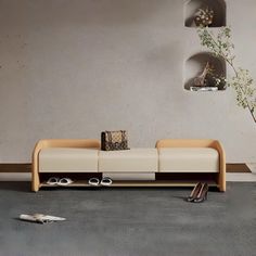 a living room filled with furniture next to a wall mounted planter and two vases