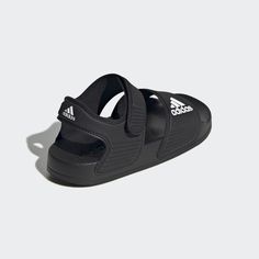 adidas Inspired by classic Adilette slides, these kids' adidas sandals are perfect for sunny days of play in and out of the water. A hook-and-loop strap creates an easy on and off. The quick-drying upper lets them play in comfort until they're back on dry land. Yoga Sandals, Adidas Sandals, Adidas Baby, Dry Land, Shower Shoes, Adidas Adilette, Designer Slippers, Kids Sandals, Kids Swimming