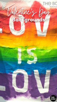 a rainbow flag with the words love is love written on it and an image of a heart