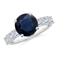 a blue sapphire and diamond ring on a white background