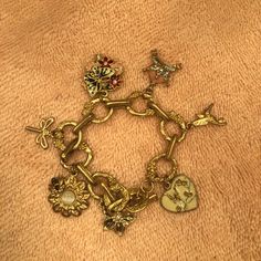 This Rare Vintage Juicy Couture Garden Themed Charm Bracelet Is Absolutely Gorgeous! The Detail In The Links Of The Bracelet Itself Are Simply Beautiful! All The Charms Are Stunning But The Heart With The White Pearl & Sakura Cherry Blossoms Is Particularly Stunning. Pictures Barely Do It Justice. I’ll Try To Snap Some Better Ones. Vintage Juicy Couture, Juicy Couture Jewelry, Sakura Cherry Blossom, Gold Charm Bracelet, Couture Jewelry, Shiny Things, Cherry Blossoms, White Pearl, Simply Beautiful