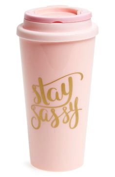 a pink coffee cup with the words stay sasy printed on it's side