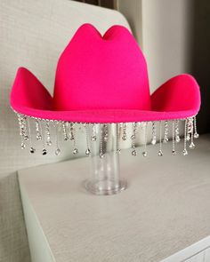 Stand out from the herd with our Glam Cowgirl Hat, featuring rhinestone fringe for a touch of bling. Perfect for rodeos, festivals, country concerts, or just everyday wear. Don't be a plain Jane, grab your glam cowgirl hat today! Western Hats With Bling For Rodeo, Western Bling Hat For Rodeo, Western Style Bling Hats For Rodeo, Festival Fedora Hats With Rhinestones, Western Style Adjustable Hat With Rhinestone Fringe, Fitted Rhinestone Hats For Festivals, Western Party Hat With Rhinestone Fringe, Adjustable Festival Hats With Rhinestone Fringe, Adjustable Rhinestone Fringe Hat For Festivals