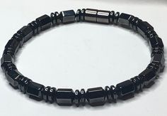 Please read the following sizing instructions carefully to ensure that your Hematite Magnetic Therapy Bracelet fits correctly: All of our Magnetic Jewelry Designs feature High Quality AAA Grade Magnetic Hematite, strung together using a 90lb Extra Strength Copolymer Craft Line. Our main focus is on strength and durability, and we also offer custom designs for a unique look. To determine your correct size, please measure your wrist and add ½" to ¾" to the measurement for a comfortable fit. It is Adjustable Flexible Black Bracelets, Adjustable Black Bracelet, Magnetic Adjustable Beaded Bracelets As Gift, Adjustable Magnetic Beaded Bracelets As Gift, Magnetic Therapy Bracelets, Sewing Tape Measure, Magnetic Beads, Power Bracelet, Magnetic Therapy