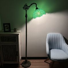 a lamp that is sitting next to a chair