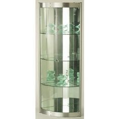 a curved display case with glass shelves on the wall in front of a white wall