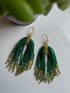 Handcrafted small batch earrings made with local glass beads. Green Long Drop Jewelry With Dangling Beads, Green Bohemian 14k Gold Filled Earrings, Handmade Beaded Earrings In 14k Gold, Dangle Beaded Earrings With 14k Gold Filled, Handmade Green Jewelry With Czech Glass, Handmade Green Czech Glass Jewelry, Unique Green Beaded Dangling Earrings, Bohemian Green Earrings With Gold Beads, Handmade Gold Beaded Earrings 14k Gold Filled