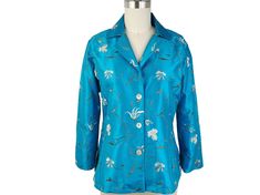 "This blouse or blouse/jacket is made of a beautiful silk embroidered fabric. The style is a princess cut, with 3 shell buttons, notched collar, slit in the sides. Back length is approximately 24 1/2\" The sleeves are 3/4 length with a slit that can be turned up as a cuff. A successful style as it is very versatile. Dress it up for a special occasion or wear it open as jacket for a relaxed look This listing is for Teal embroidery, but also available in Black. The Black is also listed separately Ikat Scarf, Ikat Blouse, Silk Chiffon Scarves, Vintage Shawls, Chiffon Wrap, Blouse Silk, Silk Ikat, Fitted Blouses, Large Scarf