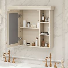 a bathroom with two sinks and an open medicine cabinet