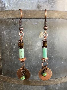 Light weight, hand crafted copper findings dangle Czech etched Picasso beads in shades of brown and turquoise with copper disk accents. Hand wrapped wire accentuates the earthy beauty of copper findings.  Rustic, elegant, and light weight. The copper components will oxidize to an delicious red/brown patina. Hand crafted in the Wild Fire Studio in the Texas Hill country. Simple sweet packaging, ready to gift.  Free domestic shipping. Artisan Turquoise Copper Earrings, Artisan Turquoise Earrings In Copper, Bohemian Jewelry In Copper Wire With Patina, Southwestern Brown Copper Jewelry, Turquoise Copper Earrings, Sweet Packaging, Earthy Beauty, Turquoise And Brown, Wild Fire