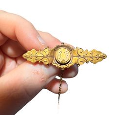 15KT Gold Victorian Etruscan revival lucky clover mourning brooch. Era: C. 1870's Marks: "W&GM 15 625" plus British hallmarks. 15 and 625 both refer to 15CT gold. Measurements: 0.6" inch long and 1.65" inches wide. Condition: Very good antique condition. Minor signs of use. One side of the clasp may have been replaced long ago. A very rare find! I have lots of other antique jewelry available. Please contact me for combined shipping. Gold Victorian Ceremonial Brooches, Victorian Gold Engraved Brooches, Victorian Engraved Gold Brooches, Victorian Engraved Medallion Brooches, Victorian Gold Brooches For Ceremonial Occasions, Victorian Gold Locket Brooches, Victorian Gold Brooch With Locket, Ceremonial Engraved Yellow Gold Brooches, Victorian Gold Brooch For Ceremonial Occasions