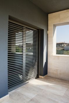 an open window with blinds on the outside