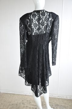 "A gorgeous 2-piece dress and jacket featuring sequins, beads, and lace. The jacket has a hidden eye and hook closure. There are two front panels that end in beads. Has shoulder pads. Brand is Dollar. Vintage size 17. Seems suited for a modern-day large, but please see below for accurate fit. CONDITION: Wonderful. No flaws to note. MEASUREMENTS JACKET Bust: 44\" Waist: 34\" Length: 46\" Shoulder span: 18\" Sleeve: 25\" DRESS Bust: 38\" Waist: 34\" Hips: 40\" Length: approx. 38\" Have a question? Gothic Party Dress With Lace Patchwork, Gothic Lace Dress For Formal Occasions, Gothic Lace Formal Dress, Gothic Lace Dress For Party, Gothic Lace Dress For Evening, Formal Gothic Lace Dress, Party Lace Dress With Long Sleeves And Lace Collar, Long Sleeve Lace Dress With Lace Collar For Party, Gothic Party Dress With Lace Sleeves