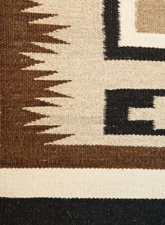 a brown and white rug with different colors