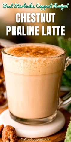 a close up of a cup of hot chocolate with nuts on the side and text overlay reading best starbucks copy recipe cheesnut praline latte