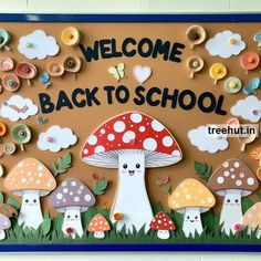 a welcome back to school bulletin board with mushrooms and butterflies on it's side