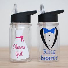 two glass jars with the words flower girl and ring bearer painted on them