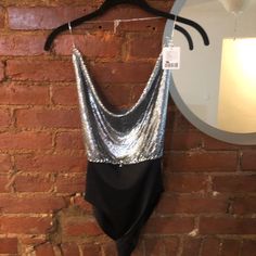 This Top Is A Super Sexy Backless Body Suit. It’s Shiny Sequin/Metal And Is Perfect For New Years Or The Club. Nwt Never Worn Chic Bodysuit With Built-in Bra For Night Out, Chic Sleeveless Bodysuit For Party Season, Chic Sleeveless Party Bodysuit, Chic Bodysuit With Built-in Bra For Evening, Chic Evening Bodysuit For Party Season, Chic Bodysuit For Date Night And Party Season, Glamorous Bodysuit For Evening Party Season, Elegant Bodysuit For Date Night And Party Season, Glamorous Evening Bodysuit